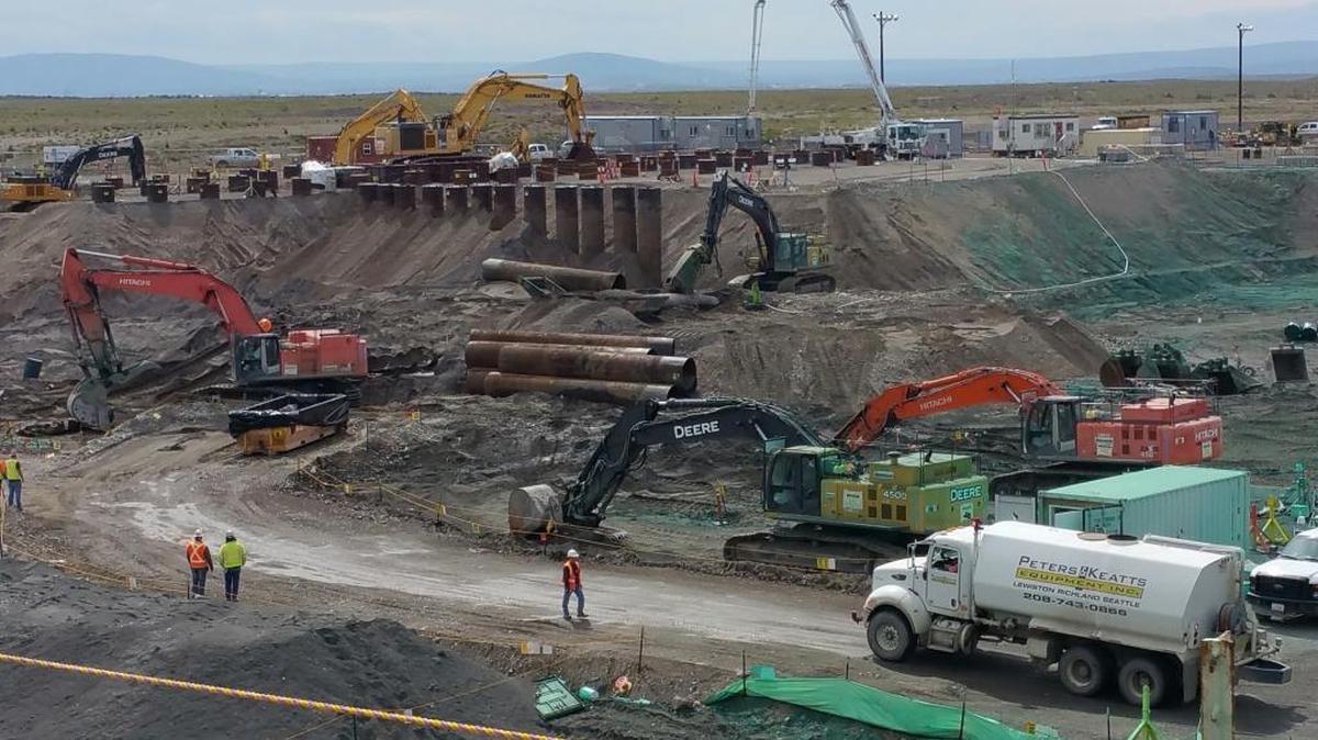 Workers encase vertical waste pipes at the 618-10 Burial Ground at Hanford during one of the site’s most challenging cleanup projects. Officials celebrated the end of the complicated cleanup of the high-hazard waste site near the Columbia River and six miles north of Richland.
