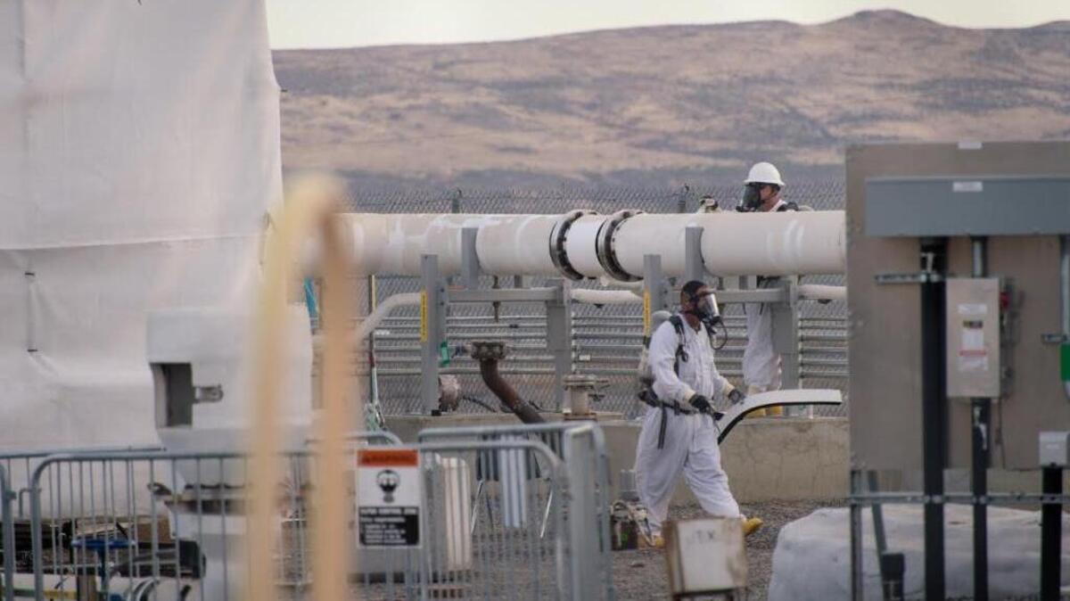 Hanford workers wear supplied air respirators as protection against chemical vapors when they are inside the fence line of the nuclear reservation’s tank farms.