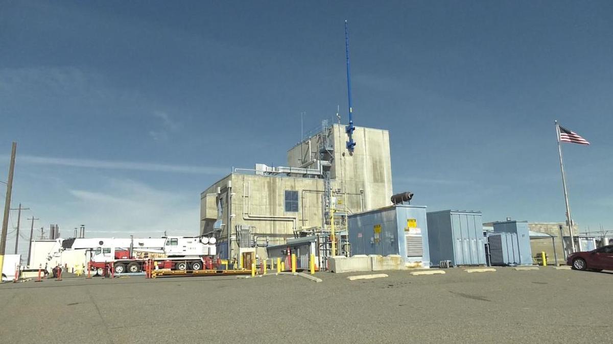 The 242-A Evaporator at Hanford is used to reduce the volume of waste held in underground tanks by concentrating liquid radioactive waste. The new blue exhaust stack was installed to better protect workers from chemical vapors.