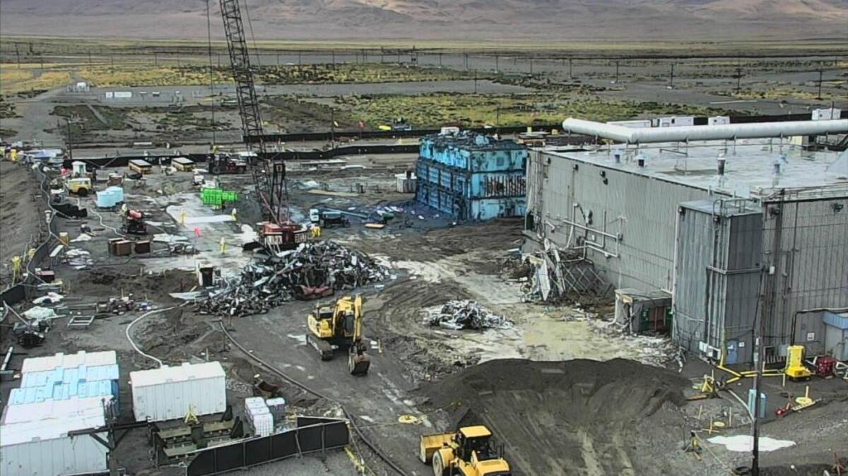 CH2M Hill Plateau Remediation Co. is tearing down the Plutonium Finishing Plant at the Hanford nuclear reservation. A contaminated glove box painted bright green for visibility was recently removed through an opening in the main part of the plant.