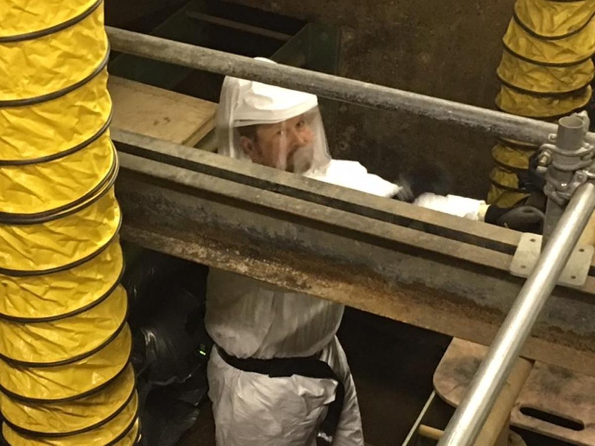 A Mission Support Alliance employee checks a filter in a Hanford water treatment system. Utilities are among the services the Hanford contractor provides across the site.