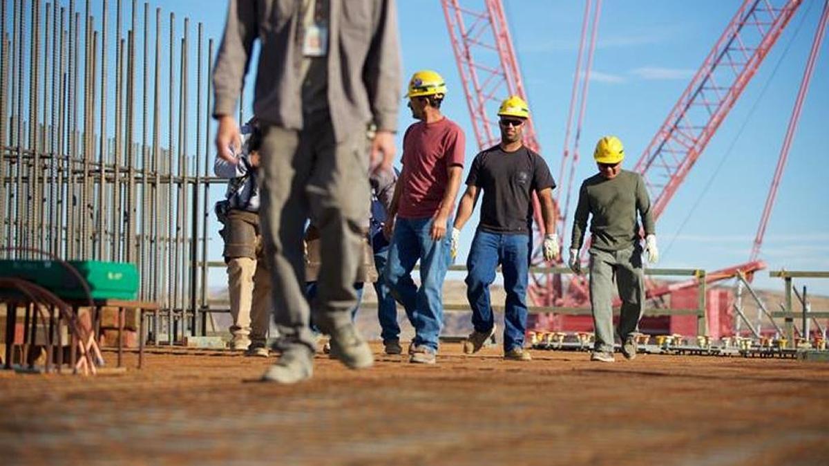 Hanford vitrification plant workers walk across the rebar flooring for the new Effluent Mangement Facility.