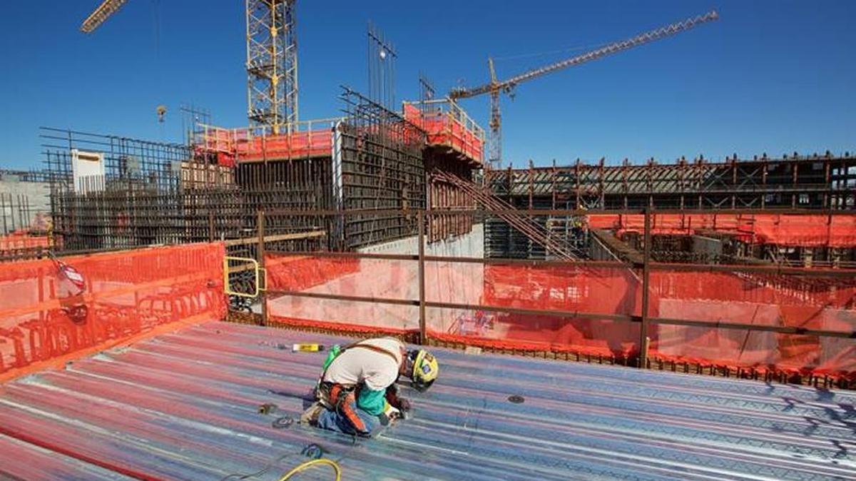 
An employee cuts through a piece of steel decking at the top of the Hanford vitrification plant’s High-Level Waste Facility.
