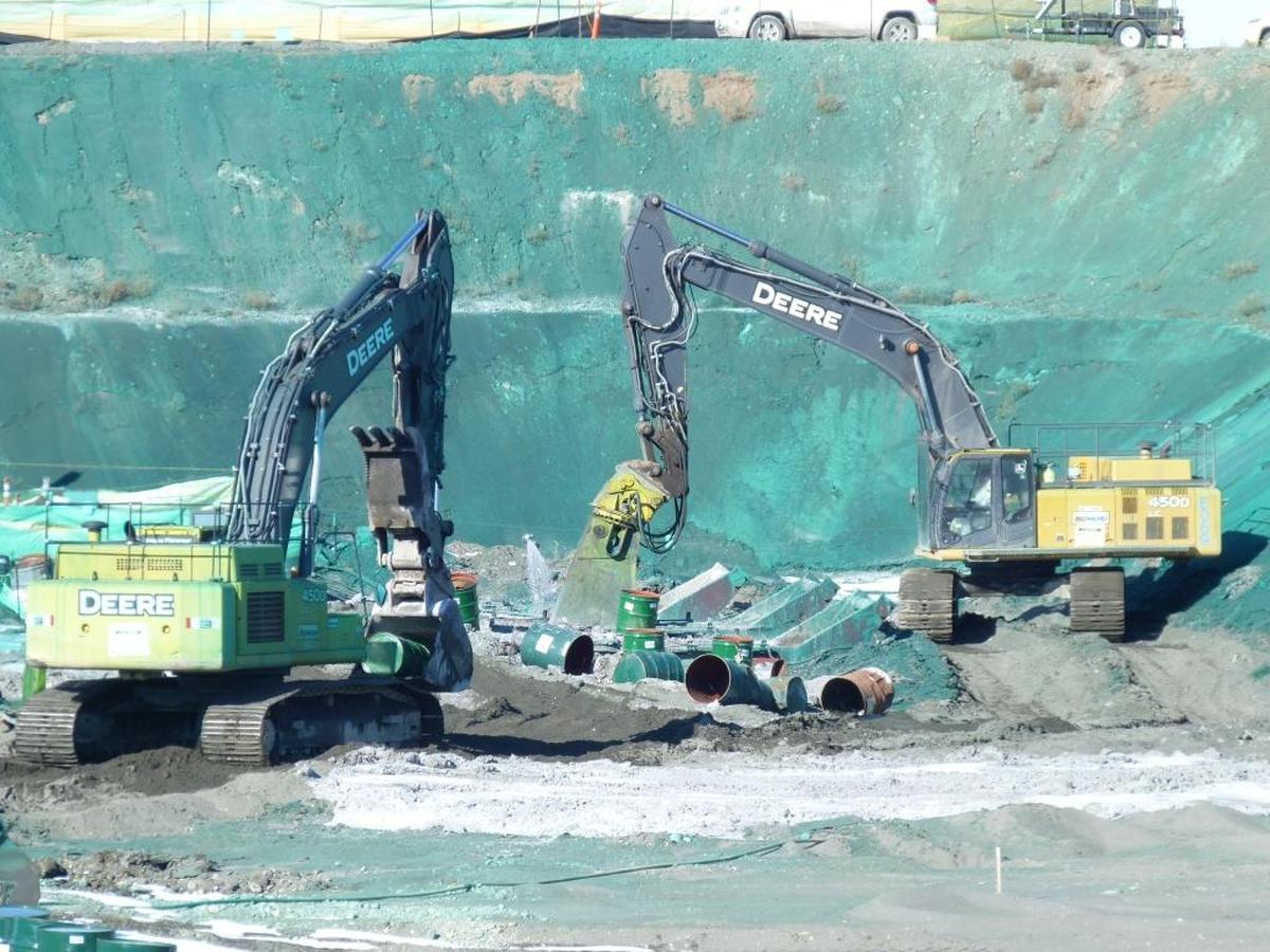 Fifty-gallon drums used to store waste at the Hanford 618-10 Burial Grounds were processed during cleanup efforts. The green material, known among Hanford workers as “rhino snot,” was a special ground spray that kept wind from blowing contamination into the air.