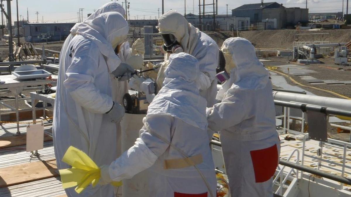 Requirements that workers use supplied-air respirators for much of the work at the Hanford tank farms have been put in place since the work shown here was done at the tank farms.