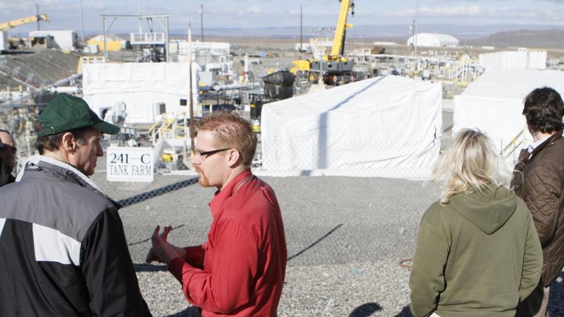 Tom Fletcher, center, talks to Sen. Ron Wyden, D-Ore., during a tour of the Hanford nuclear reservation tank farms. Fletcher has been named the Department of Energy assistant manager for the vitrification plant.