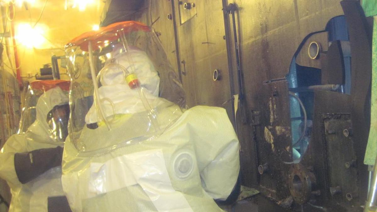 Hanford workers wear air-cooled suits for work at the Plutonium Finishing Plant in areas where there are high amounts of airborne radioactive contaminants. The Department of Energy has checked for radiation contamination in three states after potentially contaminated equipment left Hanford.