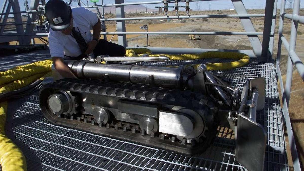 This remotely controlled crawler was used to help clean radioactive waste out of the bottom of a Hanford waste storage tank.