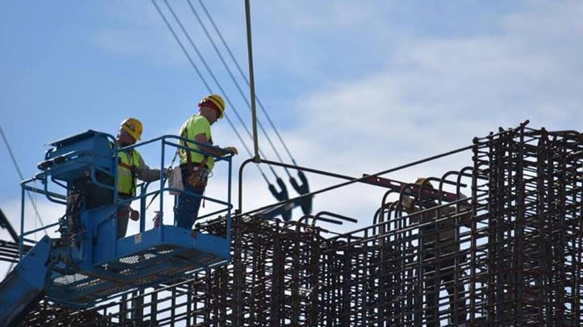 Construction continues on the Hanford vitrification plant with ironworkers installing rebar at the top of the High-Level Waste Facility truck bay wall last fall.