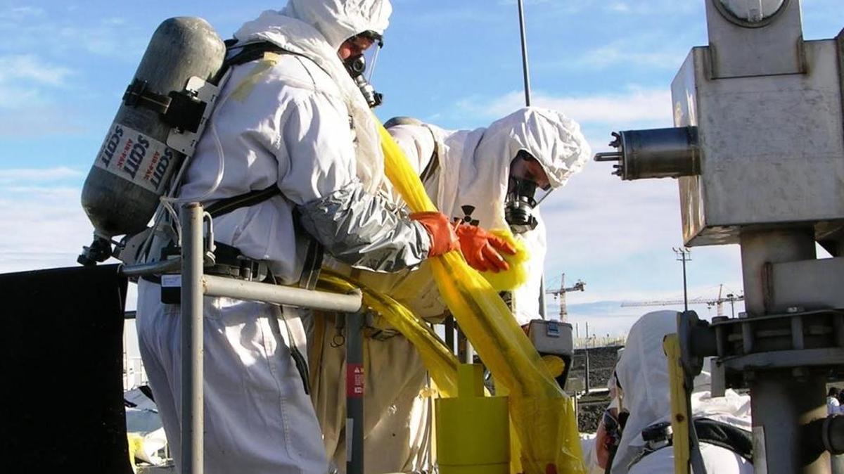 Workers are covered head to toe in protective clothing and gear at the Hanford nuclear reservation tank farms, even when the heat soars to 107 degrees.
