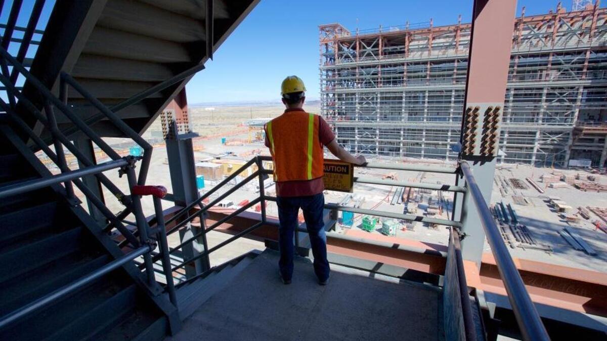 An employee looks over the Hanford vitrification plant site from a High-Level Waste Facility stairwell.