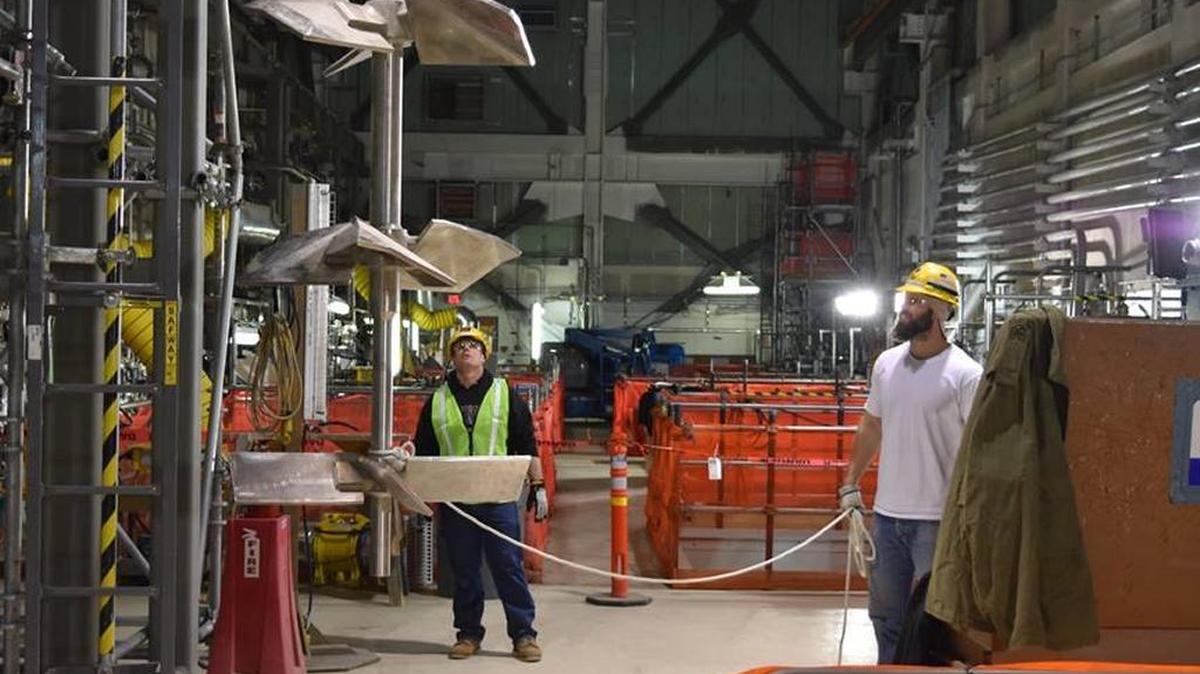 An agitator is placed in a stainless steel vessel at the Hanford vitrification plant. New deadlines for building and starting to operate the plant have been set.