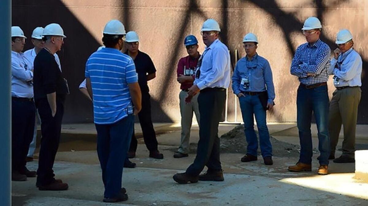 Ben Harp, center, talks to officials visiting the Hanford Cold Test Facility. He has been named the new deputy manager of the Department of Energy’s Hanford Office of River Protection,