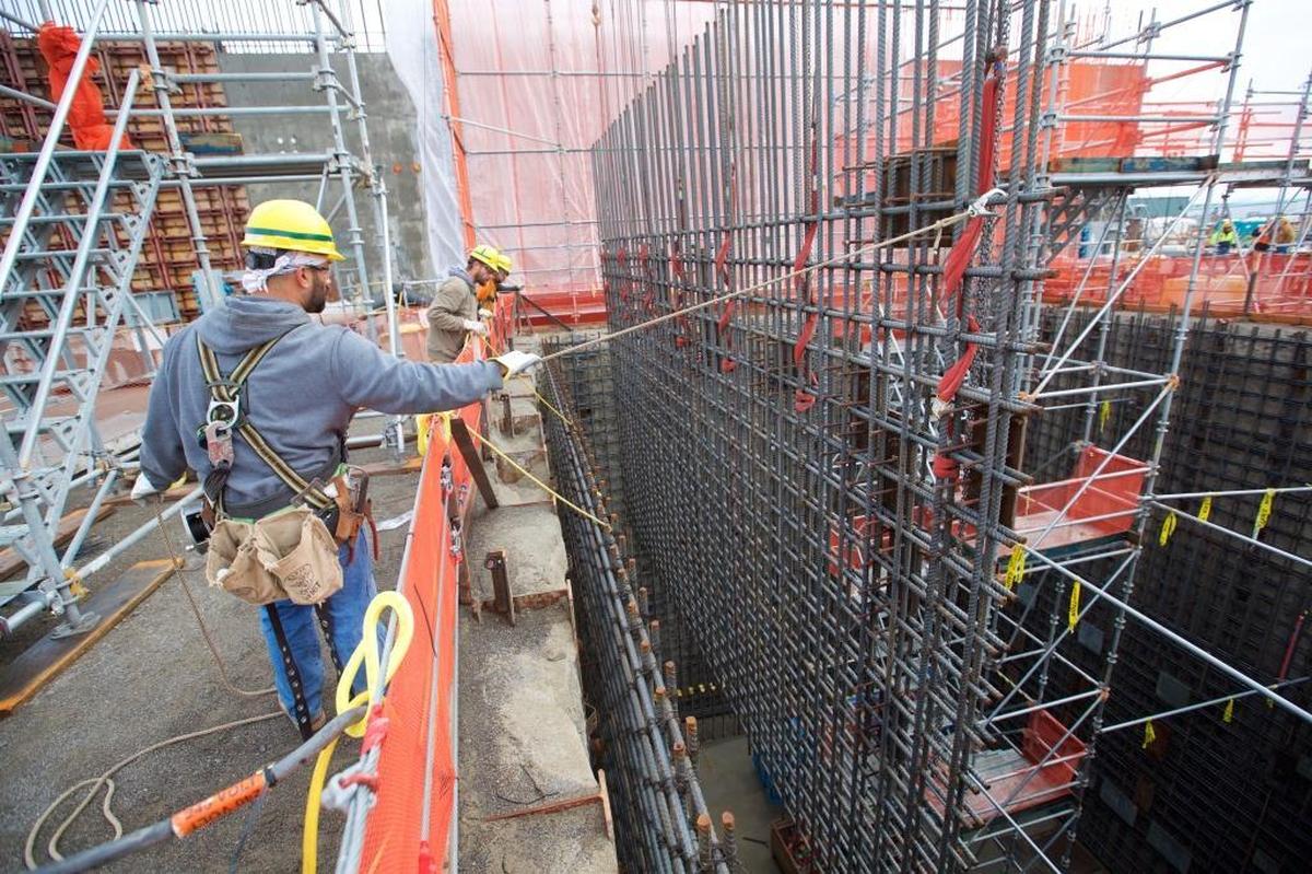 Employees at the Hanford nuclear reservation’s Waste Treatment Plant, or vitrification plant, lower a rebar curtain into the Effluent Management Facility. The facility will be needed to start treating low-activity radioactive waste as soon as 2022.