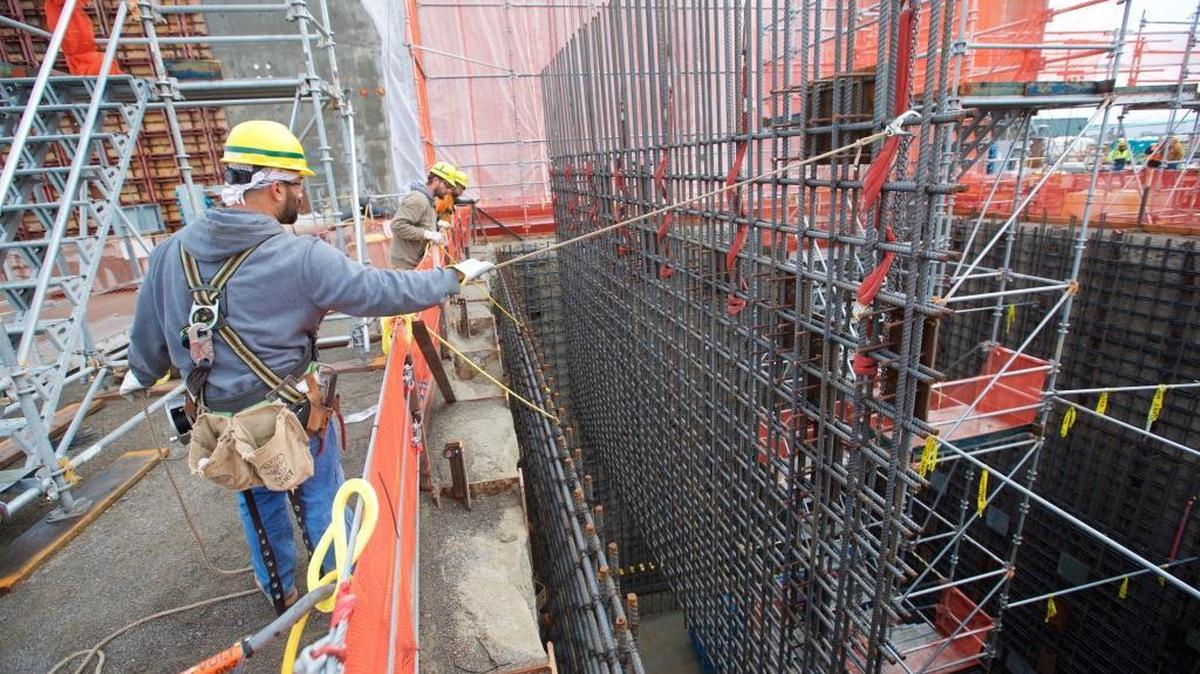 Employees at the Hanford nuclear reservation’s Waste Treatment Plant, or vitrification plant, lower a rebar curtain into the Effluent Management Facility. The facility will be needed to start treating low-activity radioactive waste as soon as 2022.