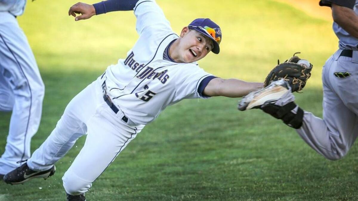 Dust Devil Bryant Aragon (25) attempts to tag out a Salem-Keizer athlete during recent baseball game. Former Hanford workers can attend the Sept. 2 game with free tickets from Nuclear Care Partners.