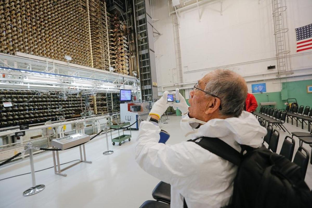 Mitsugi Moriguchi takes a photo of the front face of the reactor inside Hanford’s B Reactor in 2018. The nuclear reservation produced plutonium that would be used in the atomic bomb dropped on Nagasaki, Japan, where he was living as a child.