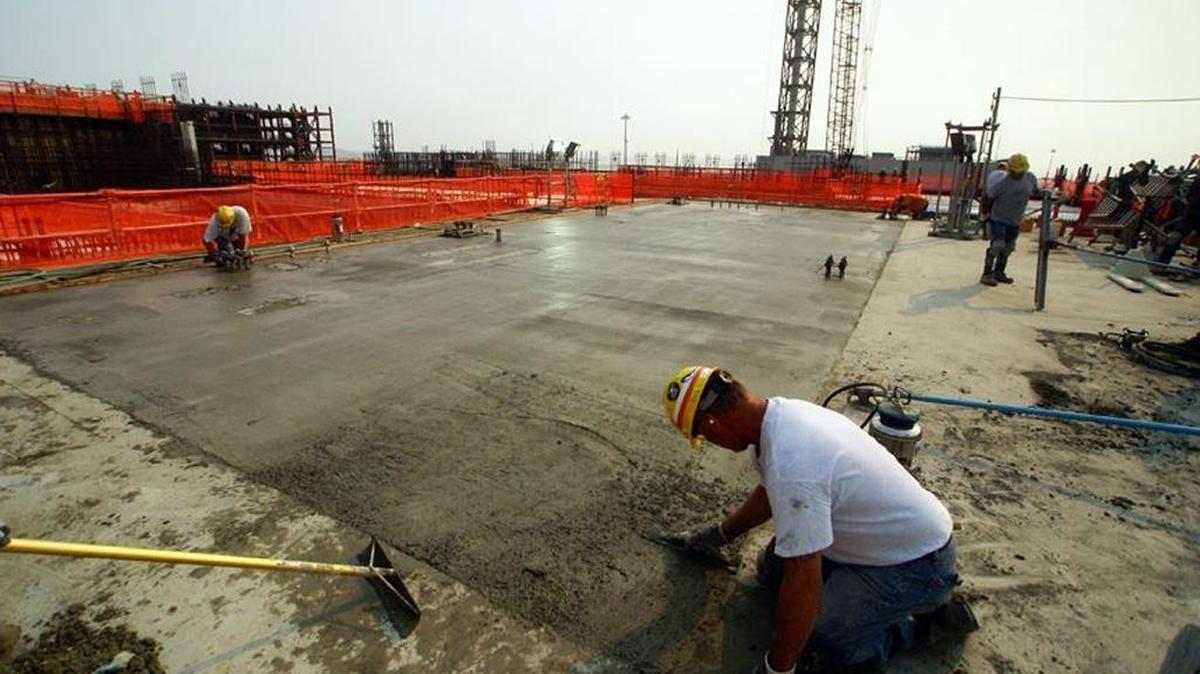 Bechtel National employees work on concrete at the 58-foot elevation of the Hanford vitrification plant’s High Level Waste Facility.
