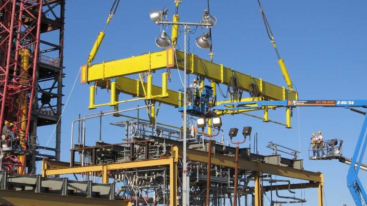 Employees at the Hanford vitrification plant prepare to lift a piping module into the Pretreatment Facility before construction on the building stopped because of technical issues. Many construction workers were laid off in 2011 and 2012.