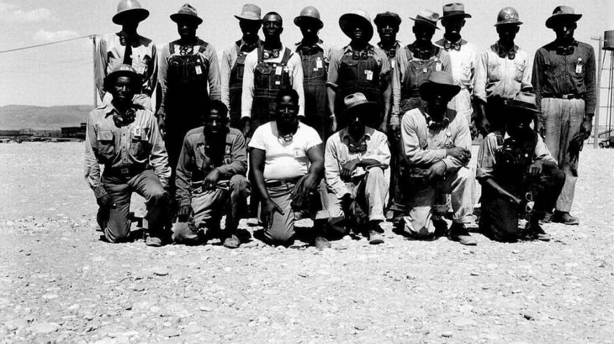 A group of construction workers pose for a photo at the Hanford nuclear reservation during World War II.
