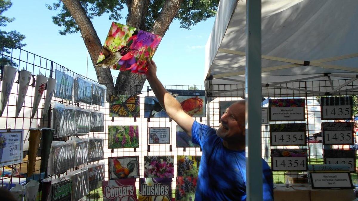 Jeff Stroh of Natural Accents holds a stained-glass cutting board created by his wife, Jodi, to the sun during the 2017 Arts in the Park at Richland’s Howard Amon Park. Hours 9 a.m. to 7 p.m. Saturday