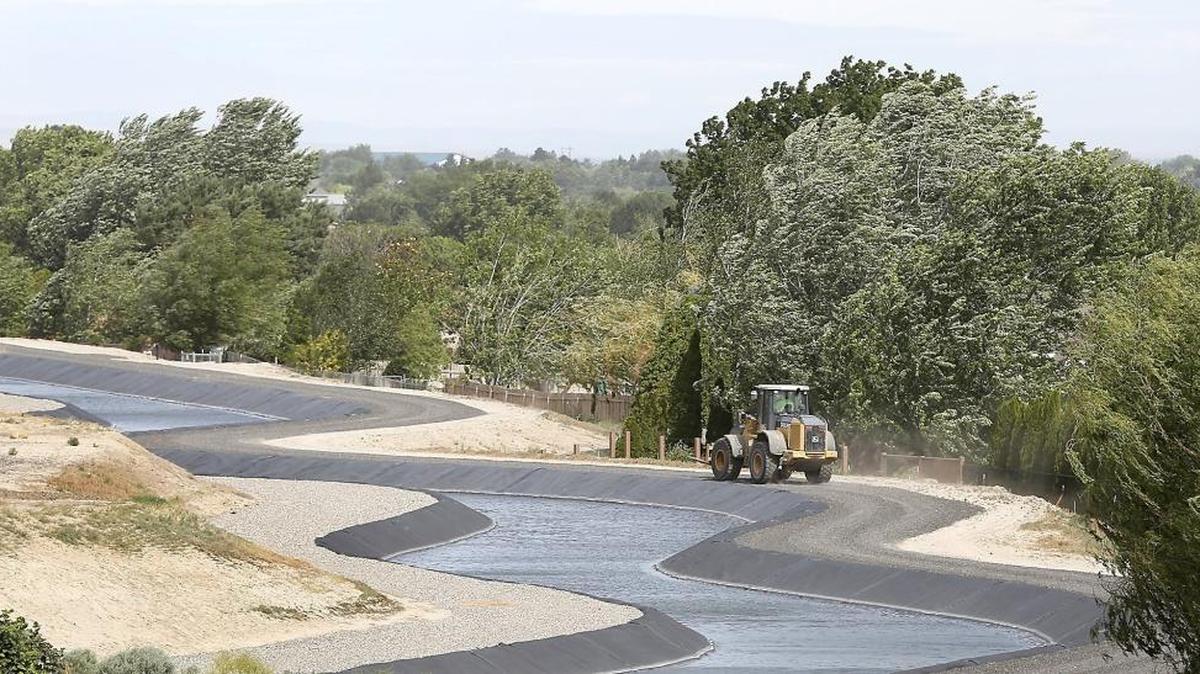 
A piece of heavy equipment is driven on the access road of a Kennewick Irrigation Canal in south-central Kennewick in June, during the drought.
