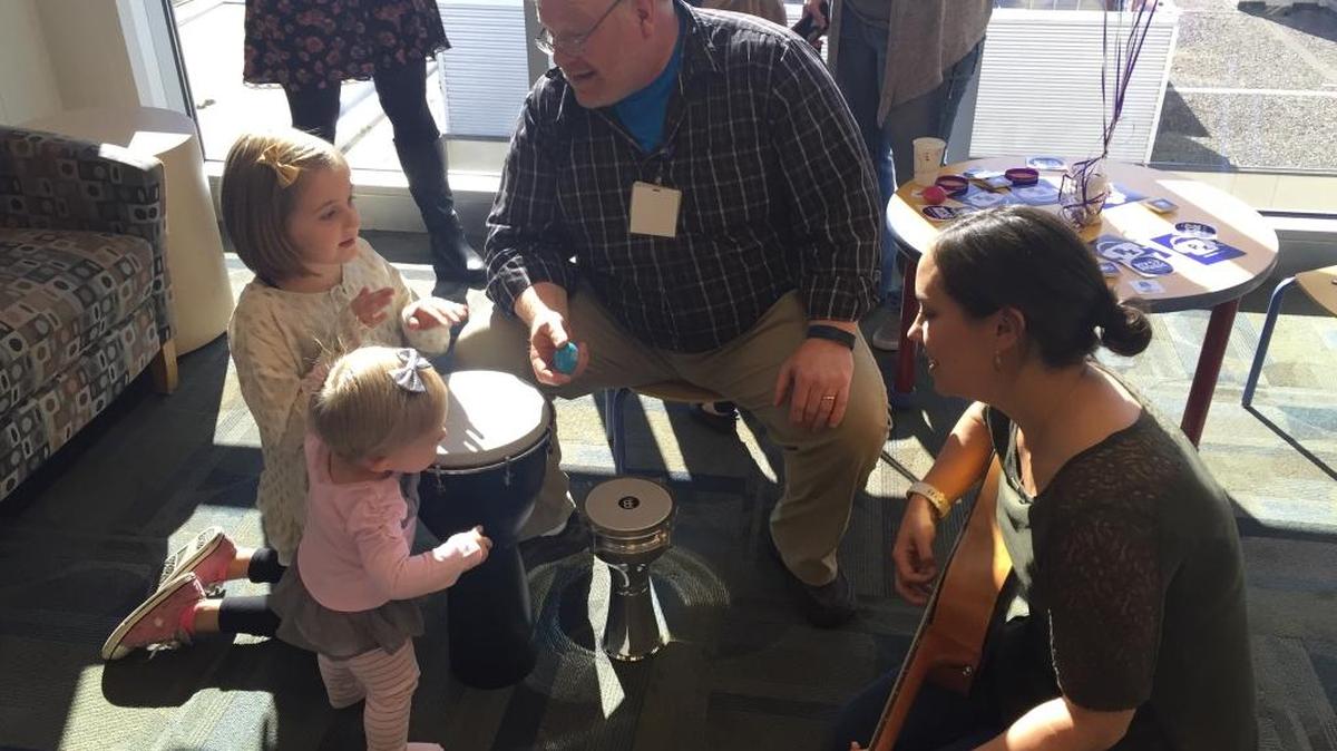 Will Talbot and Lindsay Joshlin sing with some children at Kadlec Regional Medical Center in Richland on Friday. The hospital is adding the MyMusicRx program, including carts loaded with instruments, musical games and iPads that trained volunteers wheel to the bedsides of sick children.