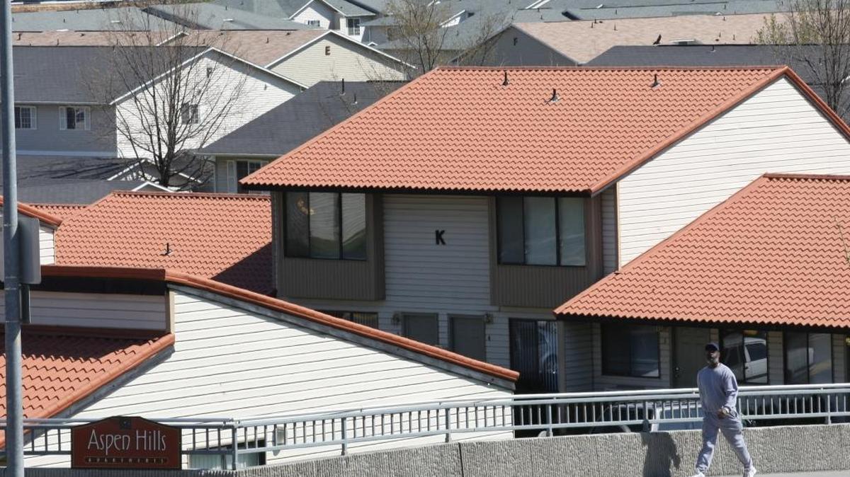 The roof lines of apartment complexes fill the background near the intersection of West 10th Avenue and South Olympia Street in Kennewick. The rising cost of renting a home or apartment in the Tri-Cities means a rising number of households spend too much of their income to keep a roof over their heads.