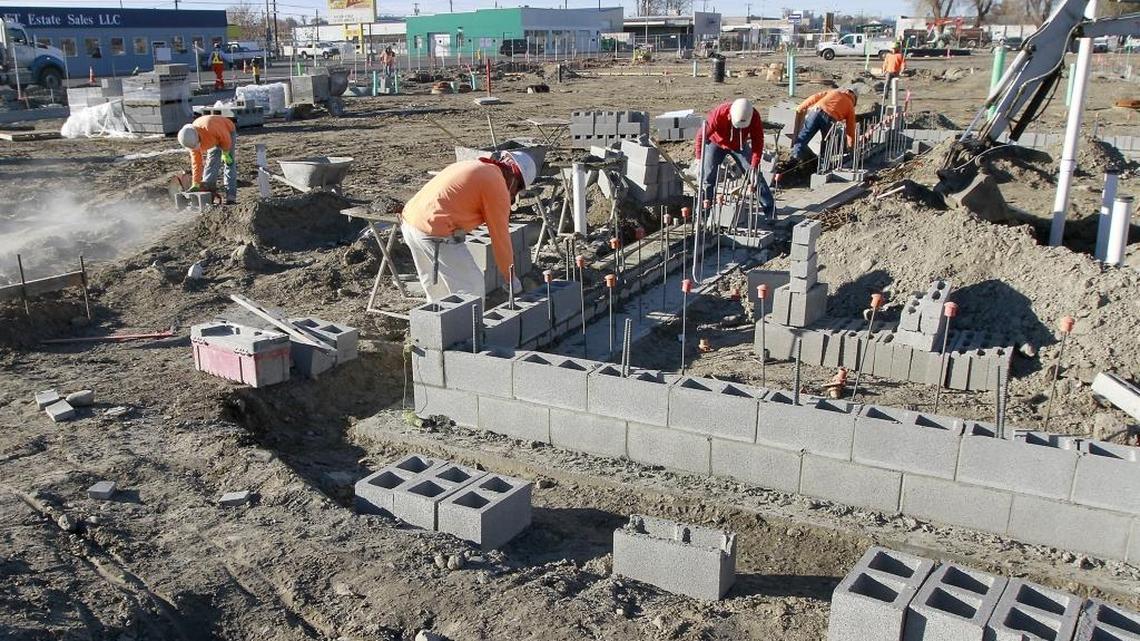 Banlin Construction personnel work on the footings for the Port of Kennewick’s Columbia Gardens Wine and Artisan Village on East Columbia Drive in Kennewick. The port agreed Tuesday to negotiate leases with Palencia Wine Co. of Walla Walla and Bartholomew Winery of Seattle. Both will make Kennewick their operational headquarters.