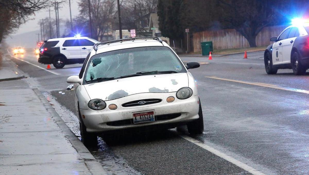 A heavily damaged windshield is visible on the passenger side of the Ford station wagon involved in Thursday’s early morning collision with a pedestrian. Watch a video at: tricityherald.com/video