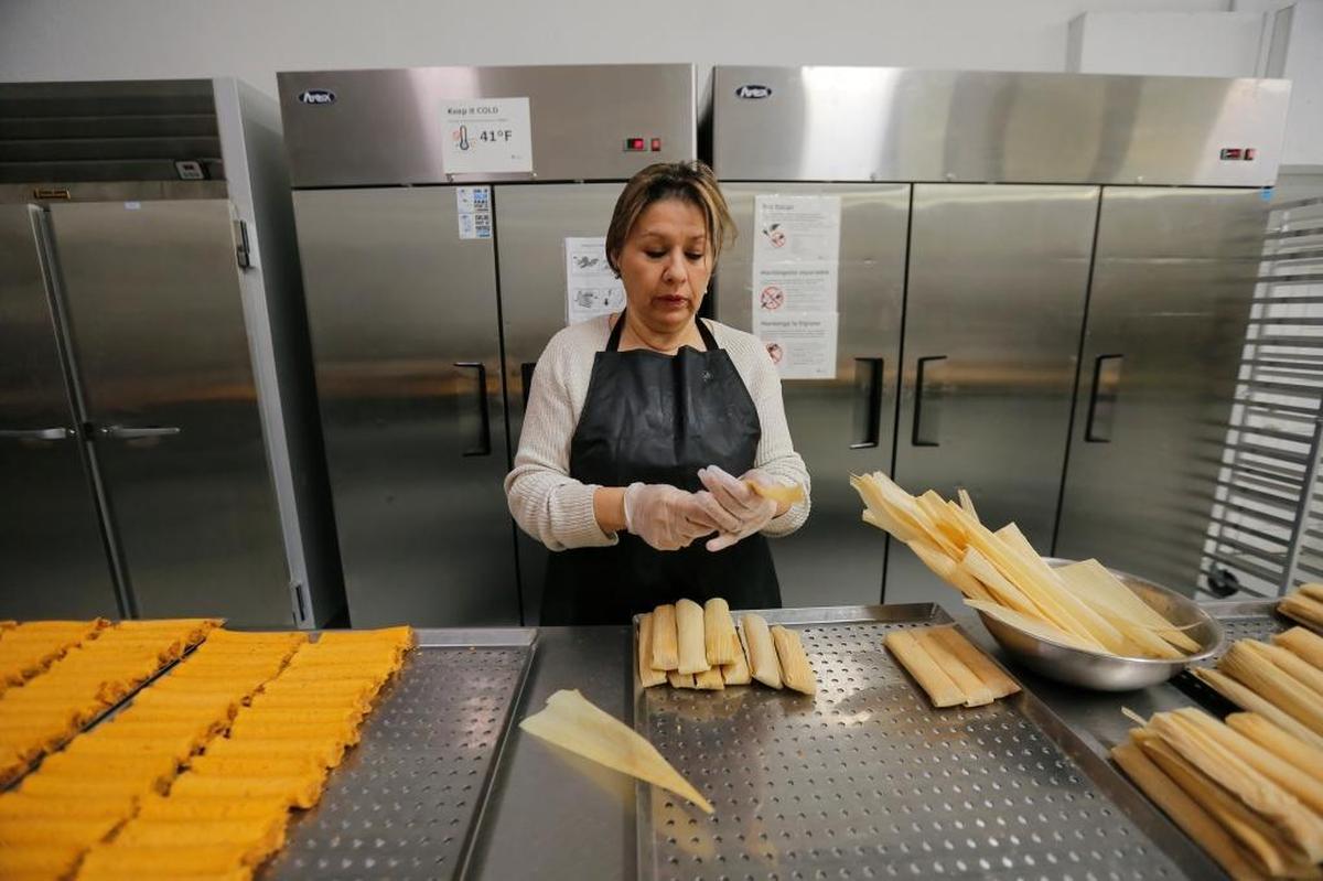 Blanca Idalia Garza, of Idalia’s Tamales, makes tamales inside a commercial kitchen in Pasco.