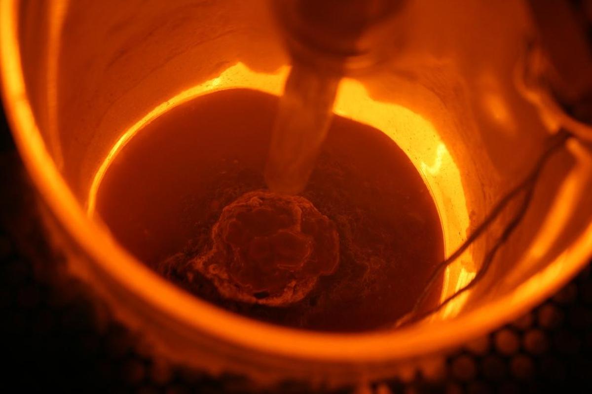 It’s not chestnuts roasting over an open fire, but a radioactive waste simulant melting into glass at high temperatures in a lab-scale melter. Scientists at Pacific Northwest National Laboratory are studying the efficiency of processing nuclear waste from Hanford reactors into glass for safe, long-term storage.