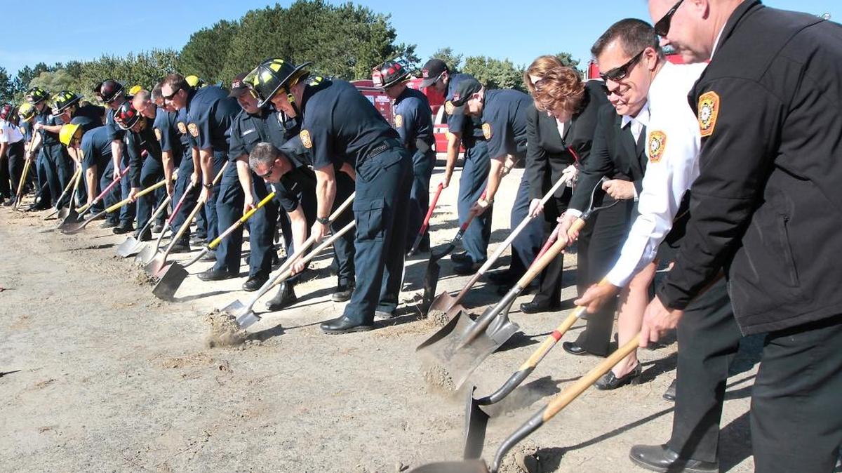 
A group of about 40 Kennewick firefighters and support staff participate in Tuesday’s ground-breaking ceremony for the future home of Fire Station No. 5 at 6016 W. 10th Ave. Many of them brought their own shovels to join a group of local dignitaries in the formal ceremony to signify the start of construction for the first new Kennewick fire station in more than 20 years.
