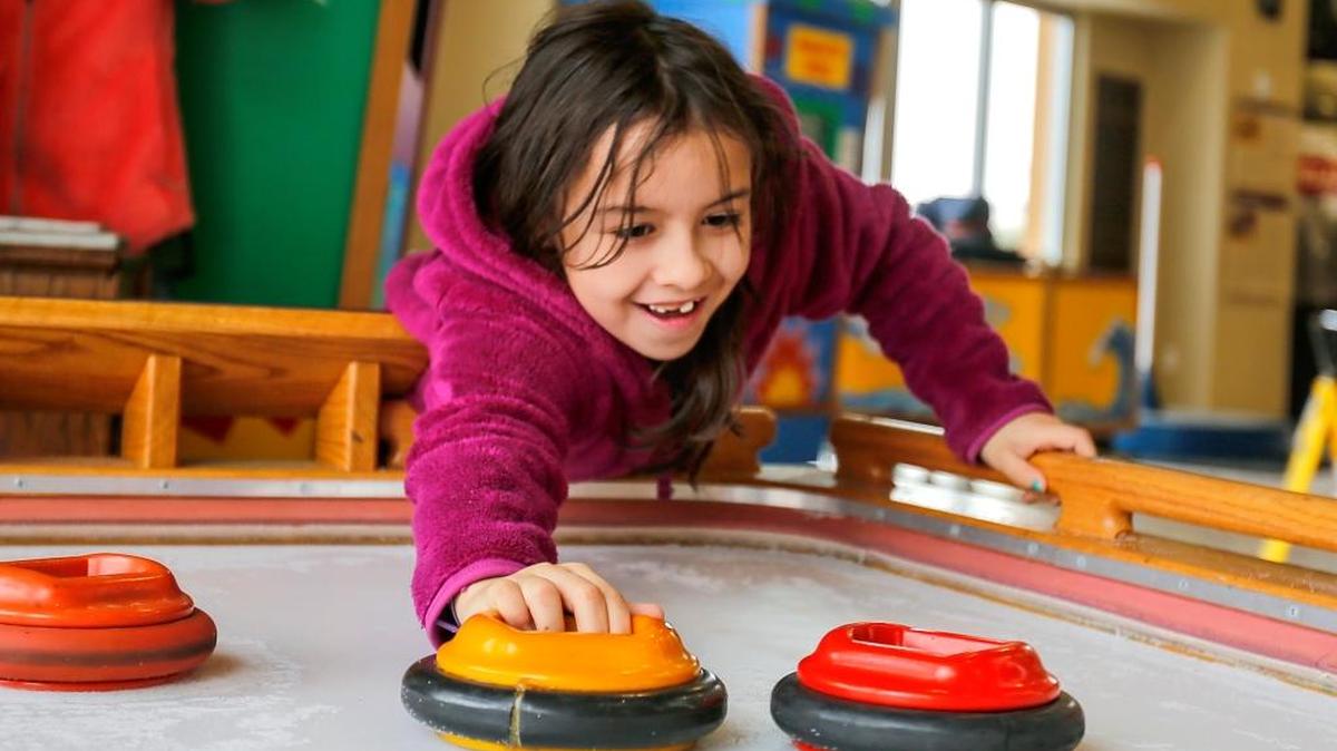 Maleela Newell, 8, plays with the Bumb-O-Ramma, a hands-on exhibit that is part of the Amusement Park Science Exhibit hosted by Hands In for Hands On Tri-Cities inside the Gesa Carousel of Dreams in Kennewick on Wednesday. Maleela was accompanied by her mother Angelica Newell of Benton City. The exhibit is free and open daily from 10 a.m. to 4 p.m. through Dec. 31. The exhibit has 12 hands-on components designed to teach children the laws of motion.