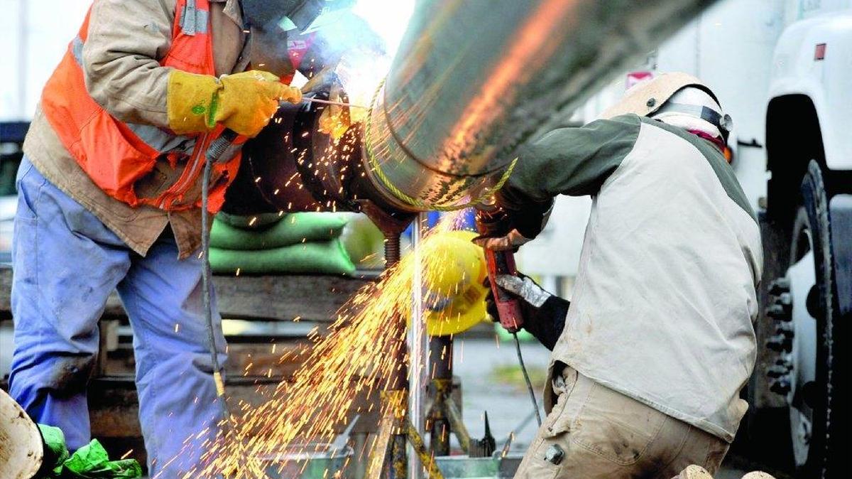 Cascade Natural Gas employees weld together two pieces of high pressure natural gas pipe in Bellingham, Wash.