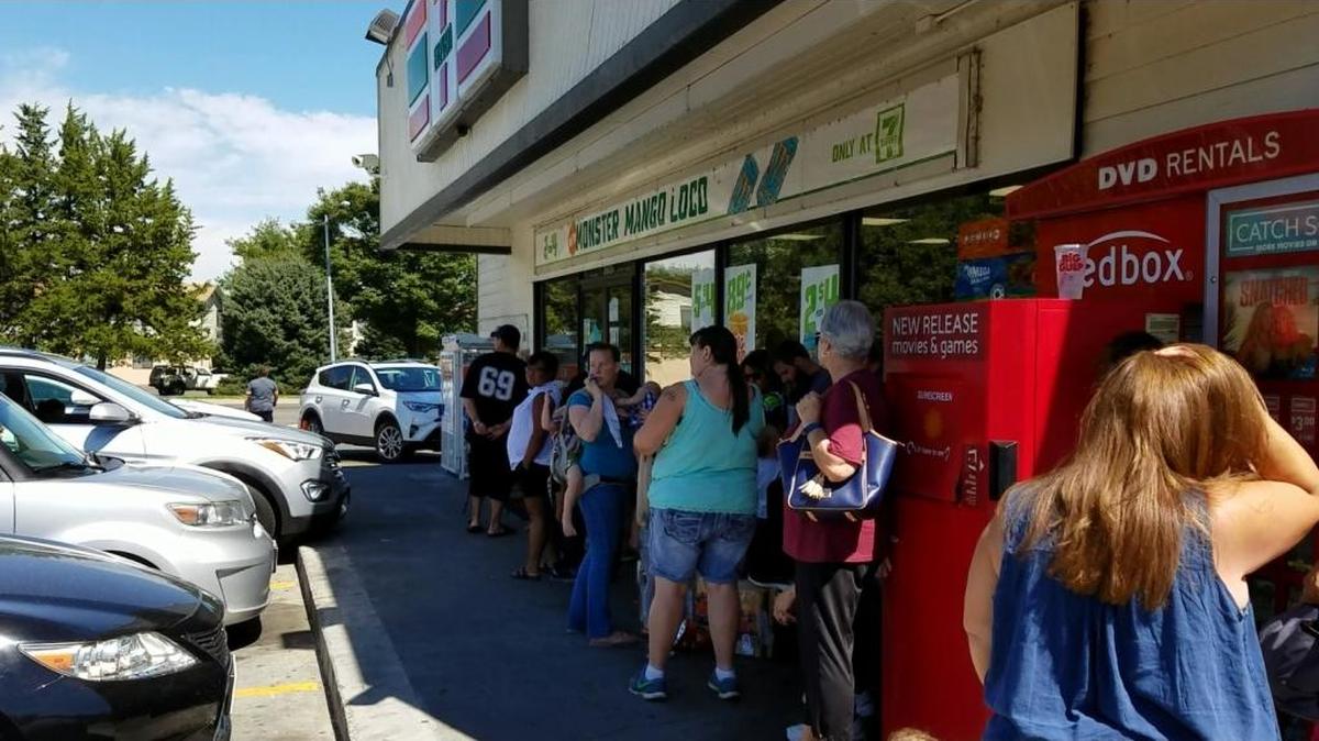About 50 people line up outside of Richland’s 7-Eleven on Friday hoping to get one of 60 pairs of eclipse viewing glasses that a FedEx truck was expected to deliver sometime that day.
