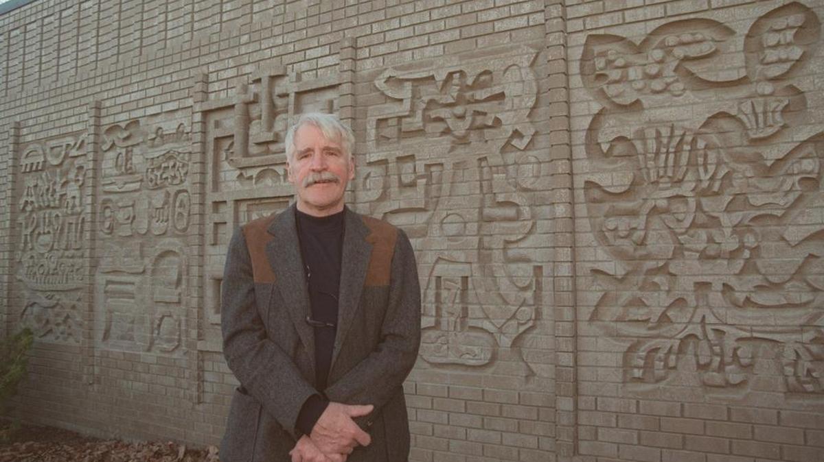 Harold Balazs stands in front of a sculpture commissioned for the Richland Public Library. The sculpture is now indoors in the library.