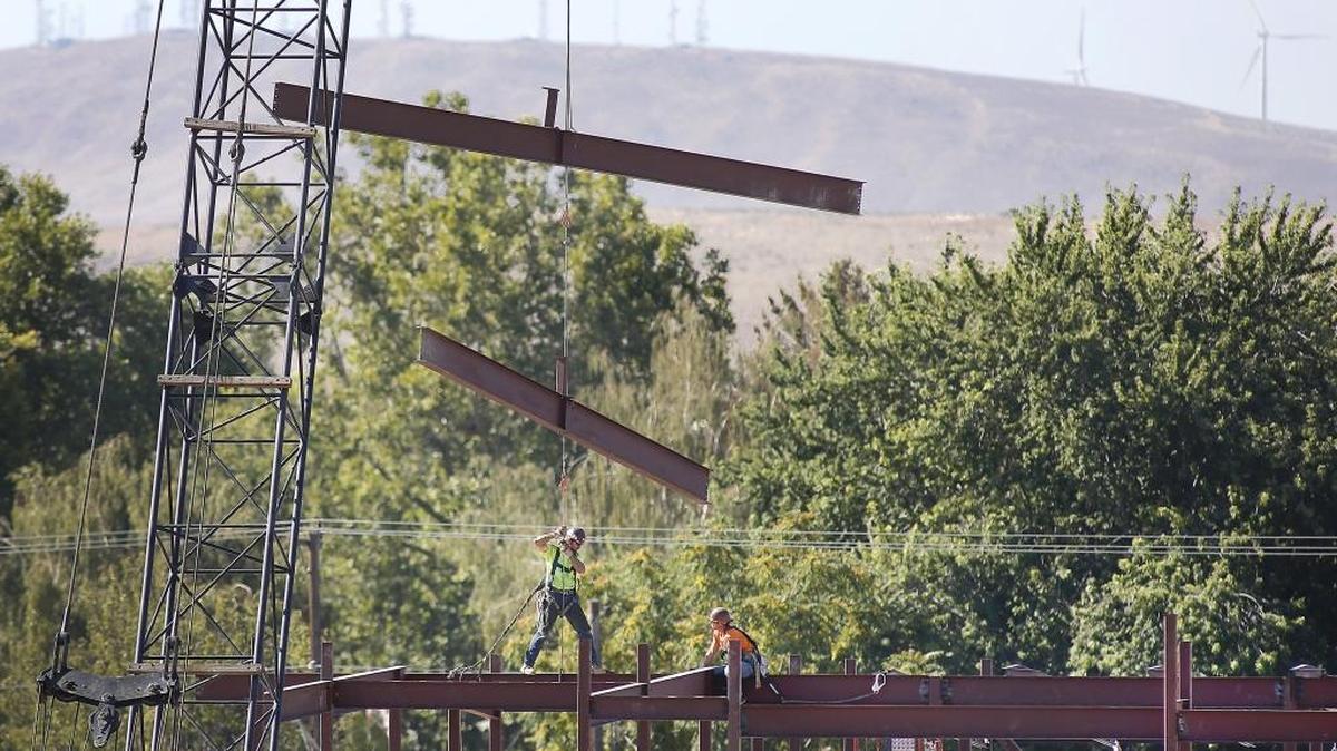 Construction workers guide steel beams into place Wednesday at the site of the new Westgate Elementary School building in Kennewick. The school is expected to open in fall 2017. The project is being paid for with a bond approved by voters in February 2015.