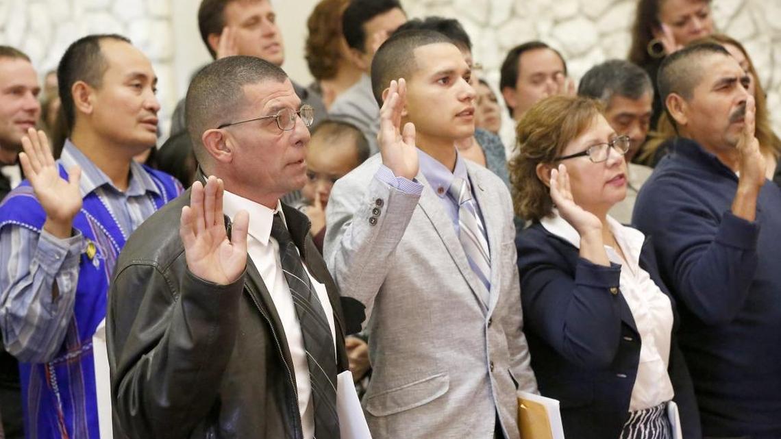 
A group of 48 immigrants from around the Mid-Columbia take part in Thursday morning’s naturalization ceremony conducted by U.S. District Court Senior Judge Ed Shea in the auditorium of the federal building in Richland. Watch a video at www.tricityherald.com
