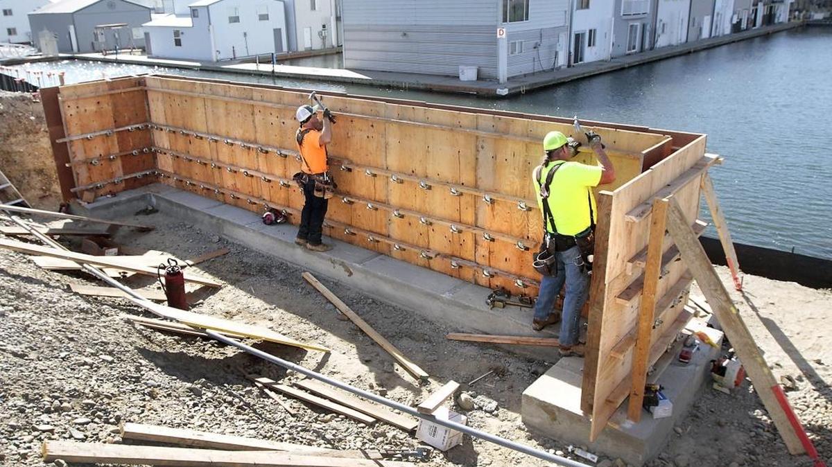 
Employee Andy Horner, left, and Bob Westfall, owner of Concrete West, work Monday assembling the form for a concrete retaining wall that’s part of a $730,000 project on Clover Island to rebuild the Port of Kennewick’s boat launch facility. The project includes landscaping, new bathrooms, paved parking and new launch ramps. A state grant of $238,000 also is helping pay for the project, according to port officials. The launch is expected to re-open in December. The general contractor is Banlin Construction of Kennewick.
