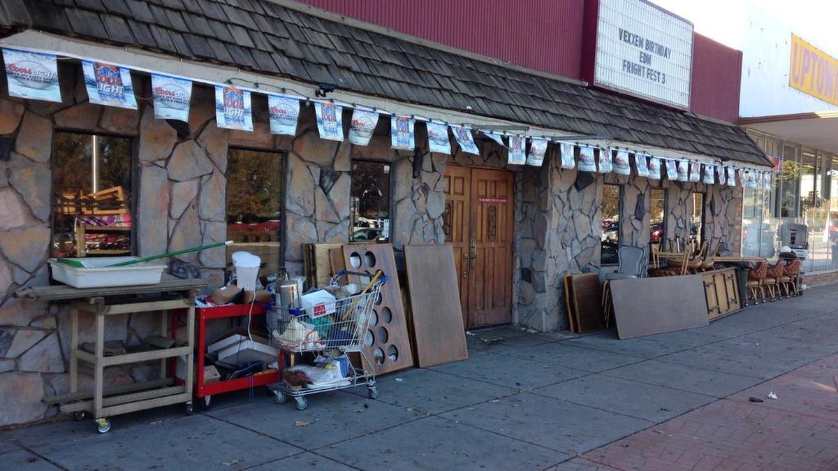 Tables, chairs and other items from Ray’s Golden Lion are stacked outside the restaurant, bar and music venue. A Benton Superior Court judge recently signed eviction papers at the request of the building’s owners.