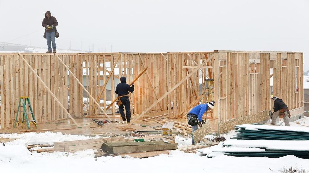 A framing crew works recently on a new home in the Ridgeline Estates housing development near the intersection of Southridge Boulevard and West 41st Avenue in south Kennewick.