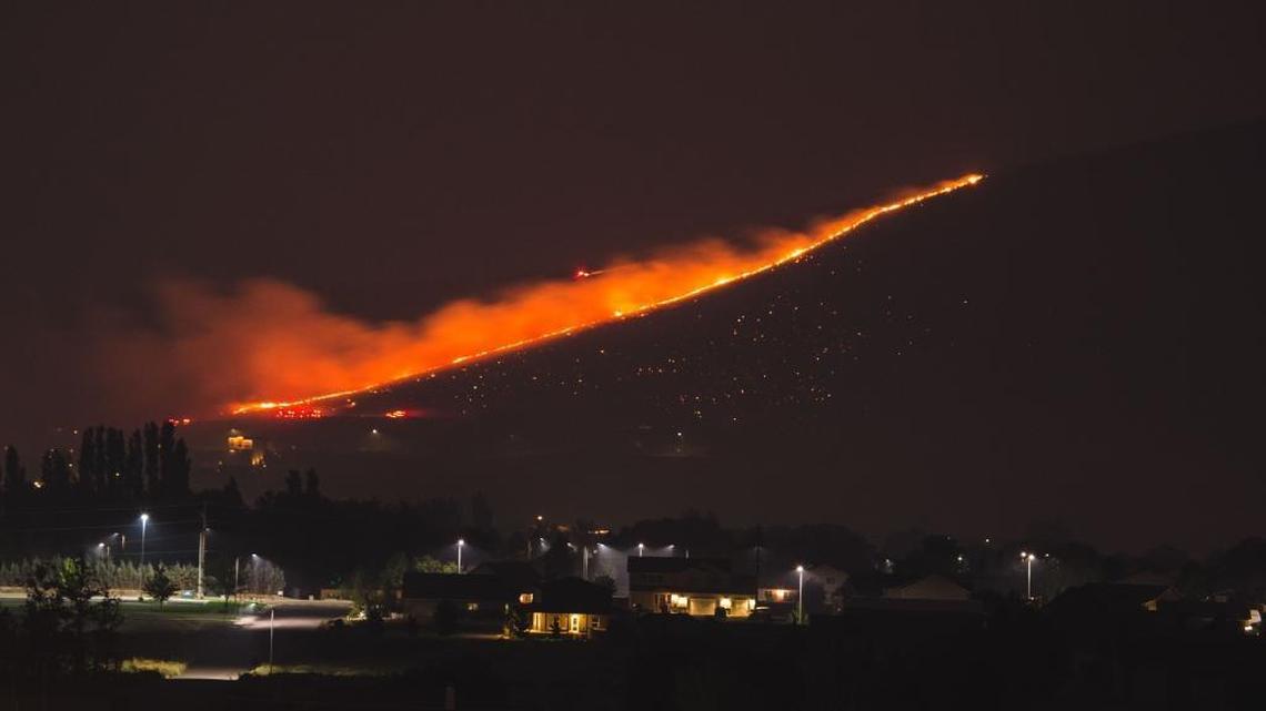 Jason Tomlinson of Richland took this photo of the fire line on the east side of Candy Mountain as it approached homes about 2:30 a.m. Friday. Homes were evacuated but no houses burned.