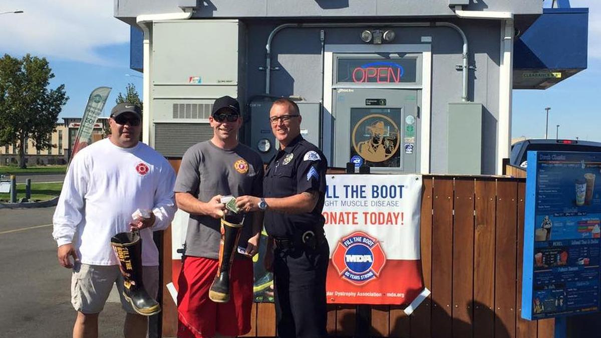 Pasco police and firefighters pose during 2016’s Fill the Boot campaign.