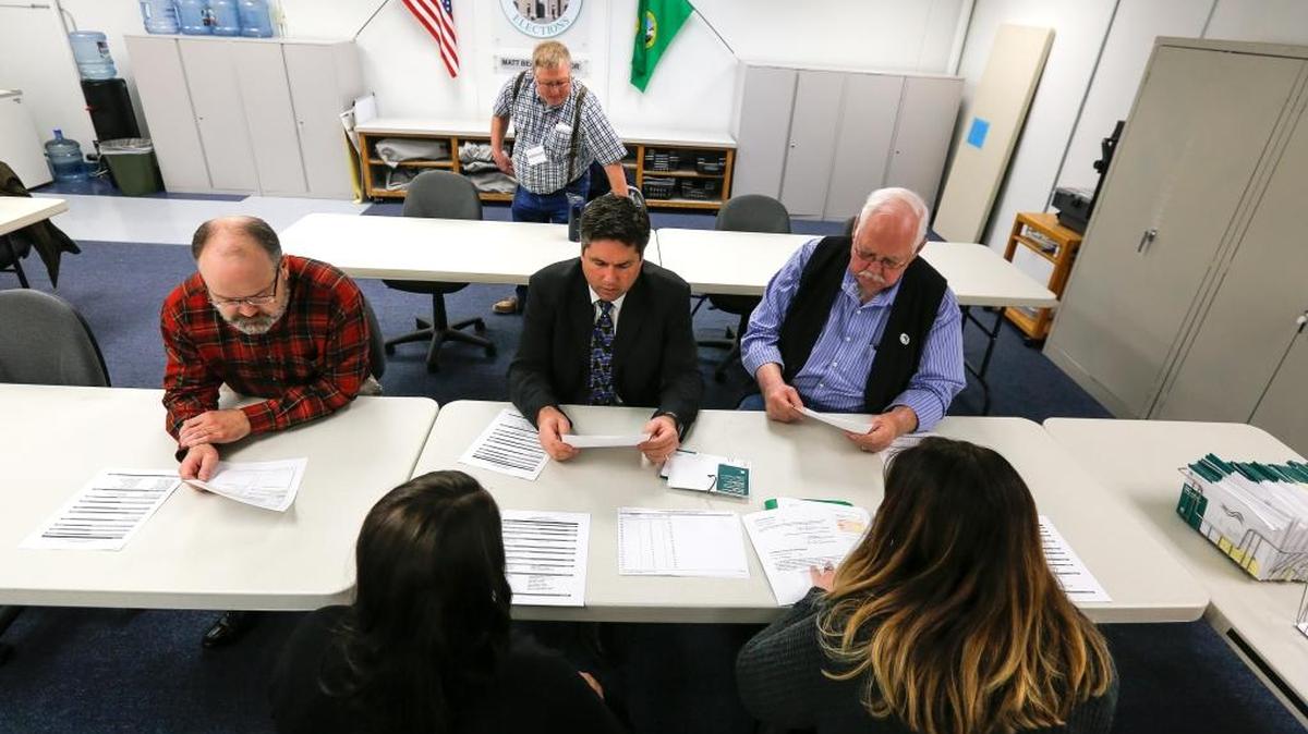 The Canvassing Board of Franklin County met to certify the Nov. 7 election on Tuesday at the Franklin County Election Center in Pasco. From left are Franklin County Auditor Matt Beaton, Prosecutor Shawn Sant and Commissioner Bob Koch. Behind them is Roger Lenk, who opposed the Pasco School District’s bond measure.