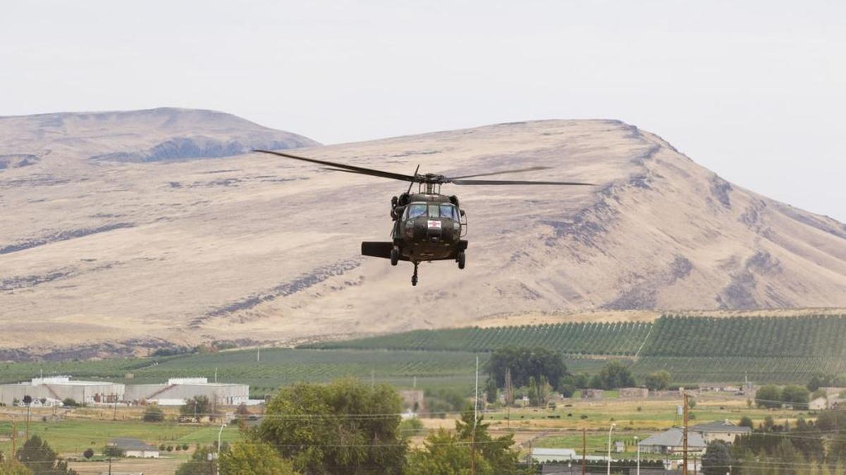 An Army helicopter from the Yakima Training Center was used early Sunday to pick up a hiker and a rescue team from the Goat Rocks Mountain range, about 15 miles south of White Pass at the 6,500-foot level. Pictured here is an Army helicopter doing a hoist rescue demonstration in Selah in August 2016.