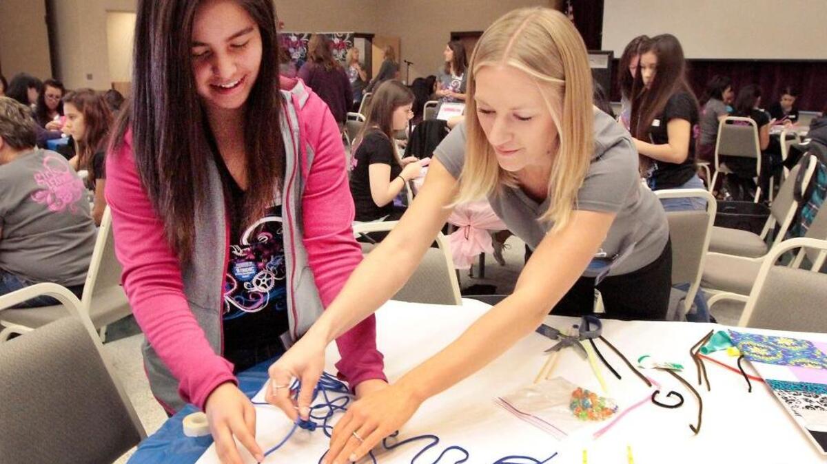 Delta High student Guadalupe Garcia, left, works with mentor Kari Olson, an employee of Focal Point Marketing and Multimedia, on a story board for her group’s project Tuesday during the sixth annual Girls Learn About Manufacturing event at Columbia Basin College in Pasco. Organizers say 70 high school students from five schools and 26 mentors from the Tri-City area took part in the interactive event designed to showcase career opportunities in the manufacturing industry.