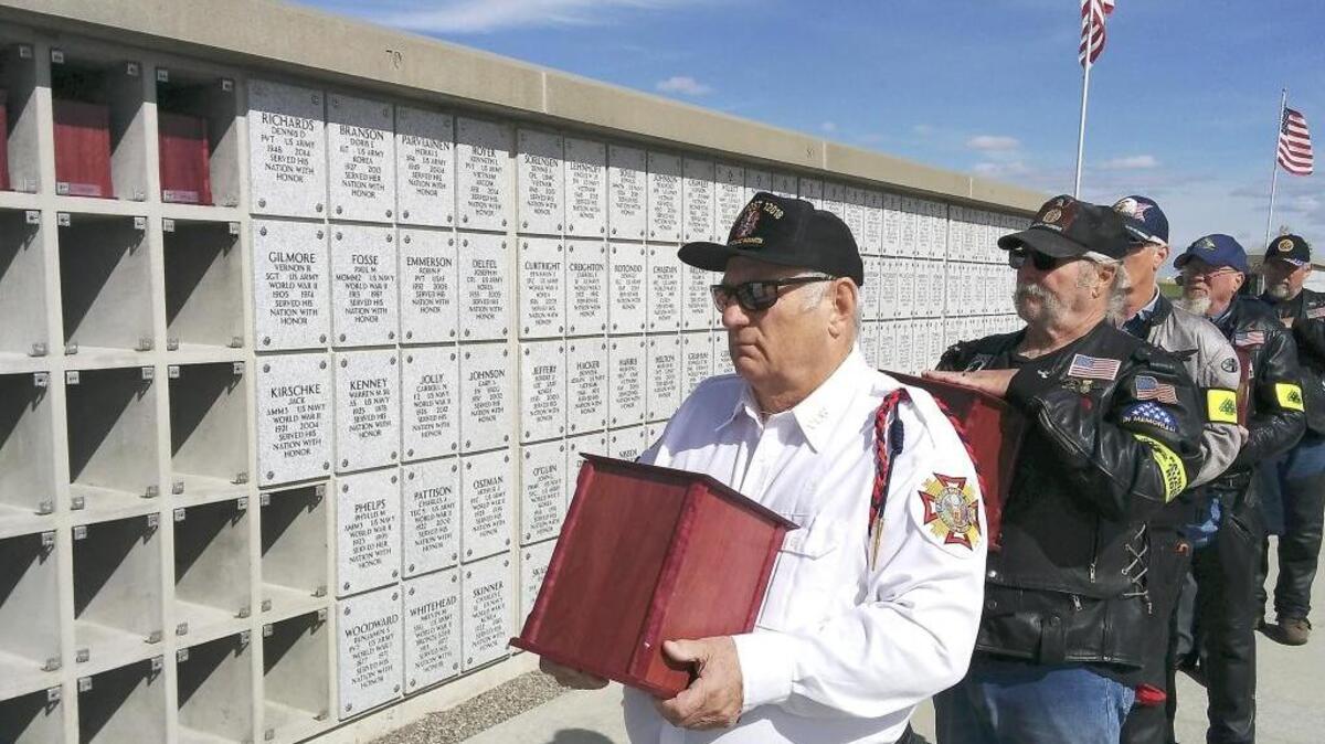 
Jerry Wallis, a member of the Veterans of Foreign Wars post in West Richland, stands at the front of the line during an interment ceremony Tuesday at the Washington State Veterans Cemetery in Medical Lake. Thirty-six of the cremated remains, some unclaimed for as long as 24 years, were from Benton County, Kennewick, Richland and Wenatchee. 
