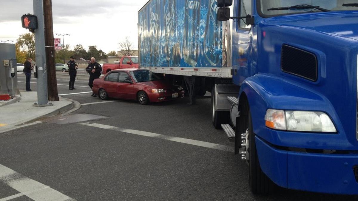 A car was stuck under a semi trailer late Wednesday morning at West Clearwater Avenue and North Morain Street in Kennewick. No one was injured. Traffic was blocked in the area.