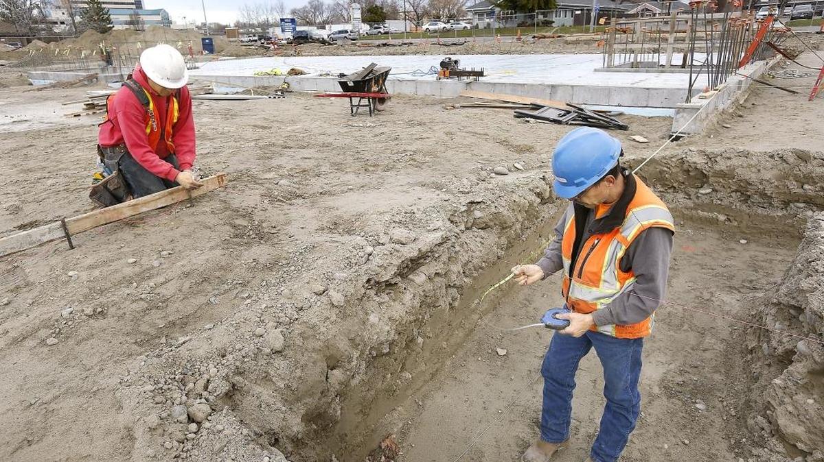 Rick Smartlowit, left, and Doug Starosta, with Leone & Keeble General Contractors of Spokane, work on the foundation footprint for the new $18.5 million Richland city hall. The three-story, 40,000-square-foot building will consolidate city offices now in three aging buildings for about 90 employees. It’s expected to open in spring 2019 at 625 Swift Ave, hear the Federal Building parking lot.